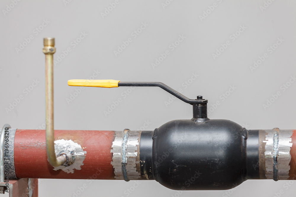 A heating system unit against a gray wall. A heating system unit against a gray wall.