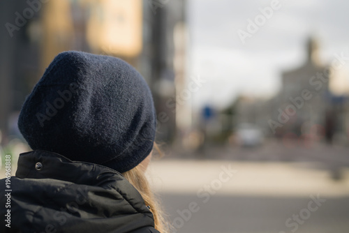 teen girl from behind walking in the city on a autumn day © GCapture