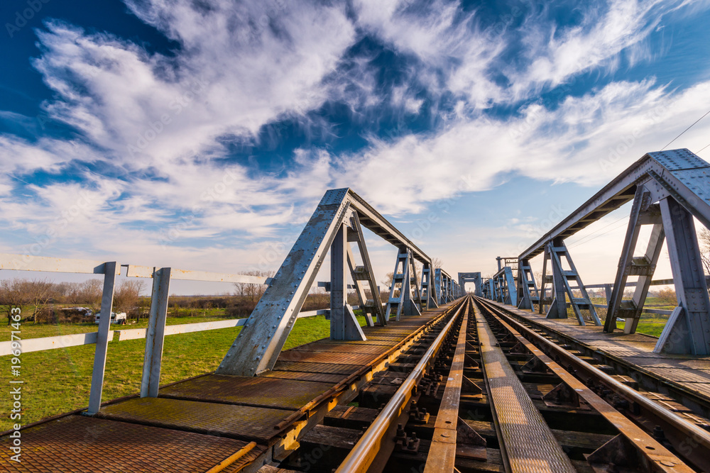 Old iron railroad bridge in remote rural area in Europe Old iron railroad bridge in remote rural area in Europe