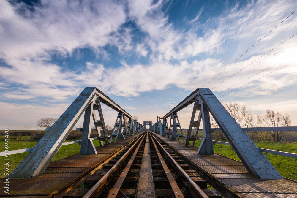 Old iron railroad bridge in remote rural area in Europe Old iron railroad bridge in remote rural area in Europe