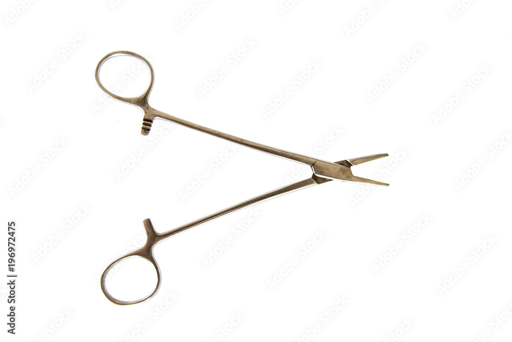 Surgical Instruments (tweezers, pliers, clamp the blade, scalpel, scissors) on a white table. Surgical Instruments (tweezers, pliers, clamp the blade, scalpel, scissors) on a white table.