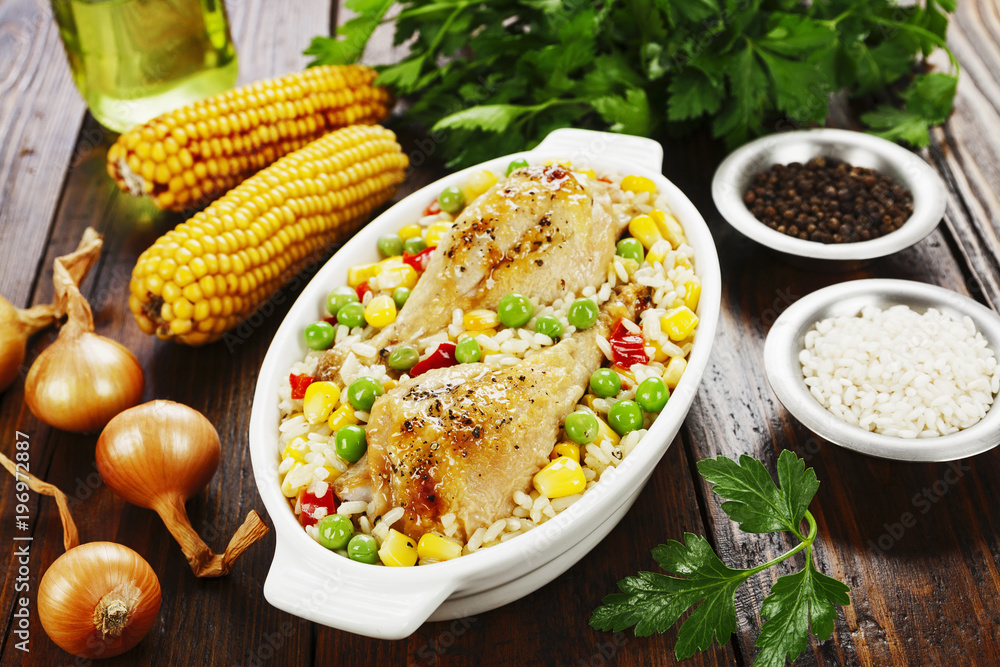 Chicken legs baked with rice and vegetables Chicken legs baked with rice and vegetables