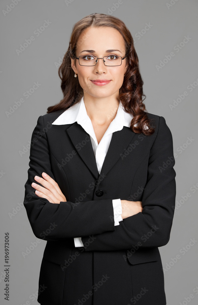 Smiling businesswoman, over gray Smiling businesswoman, over gray