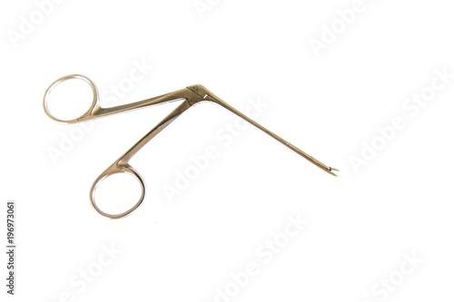 Surgical Instruments (tweezers, pliers, clamp the blade, scalpel, scissors) on a white table.