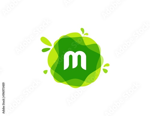 Letter M logo at green watercolor splash background. green nature logo vector