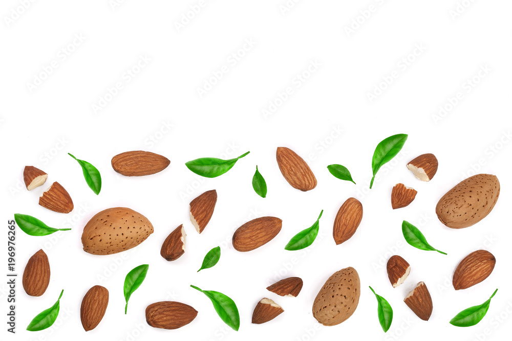 almonds decorated with leaves isolated on white background with copy space for your text. Top view. Flat lay pattern almonds decorated with leaves isolated on white background with copy space for your text. Top view. Flat lay pattern