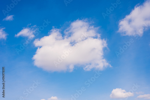 Beautiful blue sky with sunlit clouds