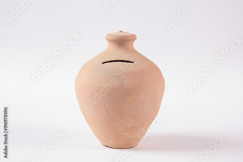 Isolated image of Small Money Bank, Clay pot for saving money called Gullak in Hindi and Urdu language. photo