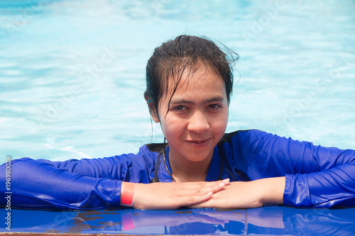Asian woman swimming pool