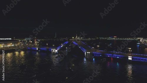 Aerial cinematic view of st. Petersburg city. Neva river panorama. drawbridge in St. Petersburg, Russia. Palace bridge. Evenig. Quadcopter drone unique high altitude flight over city. 4K footage.