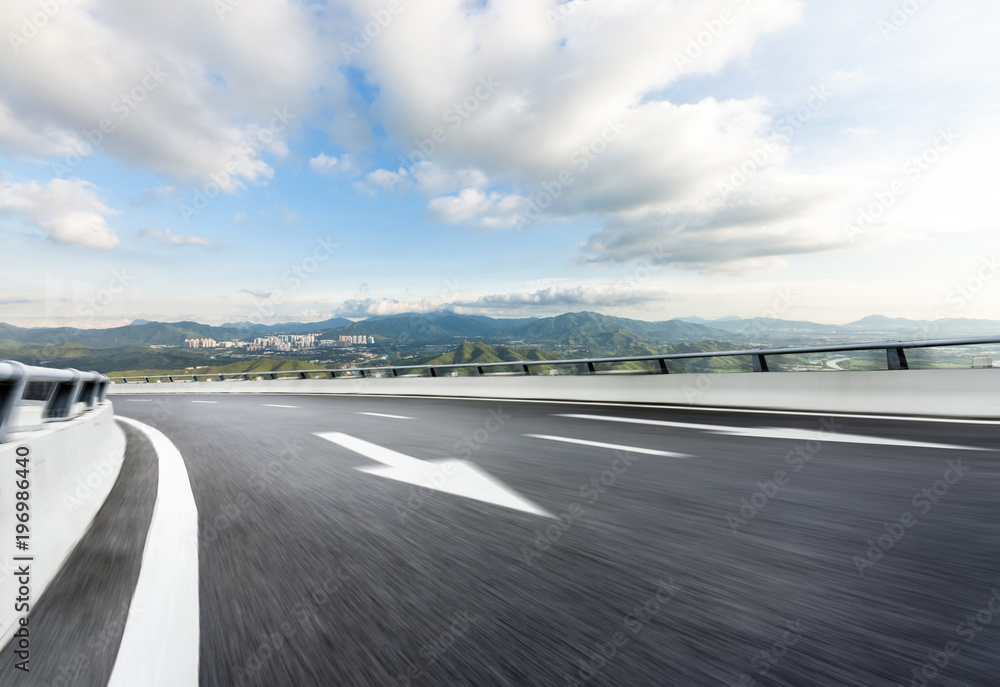 Naklejka premium empty raod with modern office building 