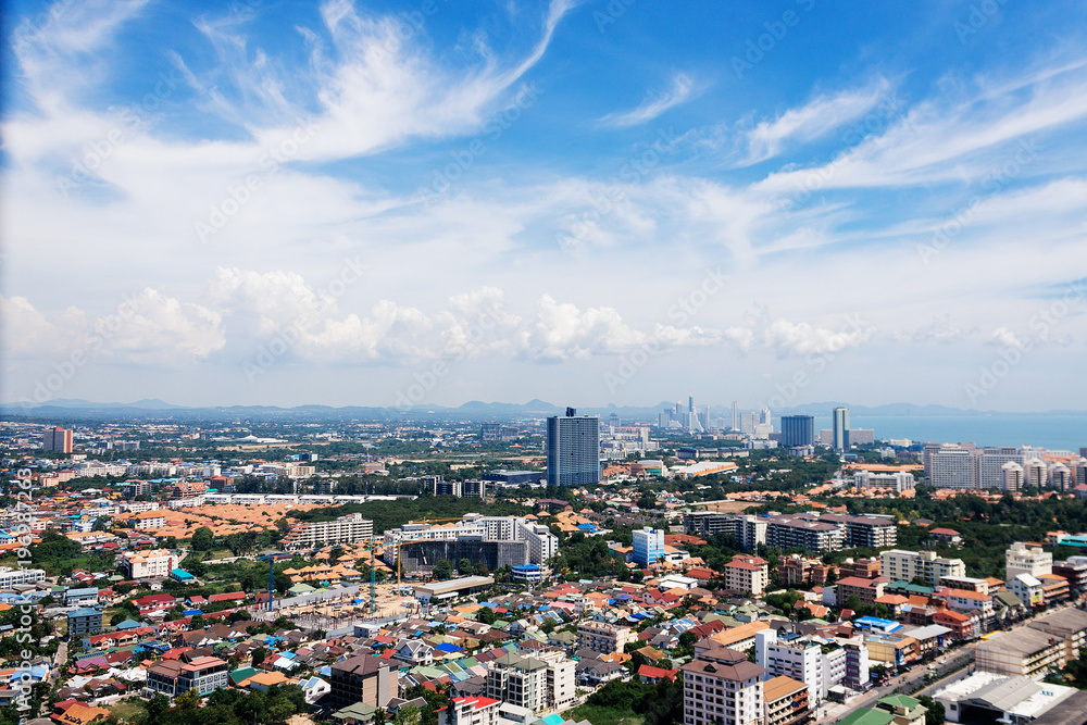 Morning cityscape with high pamoram view of Pattaya from Unixx condo. Modern buildings. High panorama with blue sky and clouds.