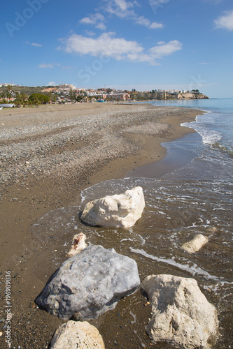 La Cala del Moral playa east of Malaga and a beach near to Rincon de la Victoria on the Costa del Sol Spain with white rocks photo