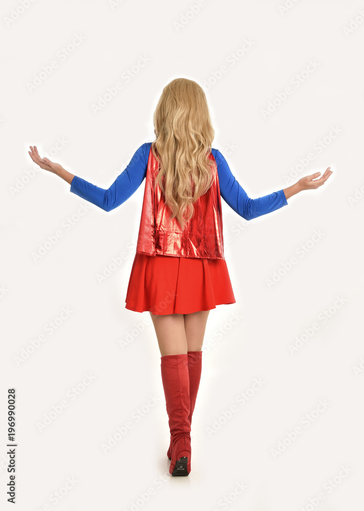 full length portrait of pretty girl wearing super hero costume, standing pose, isolated on white studio background. full length portrait of pretty girl wearing super hero costume, standing pose, isolated on white studio background.