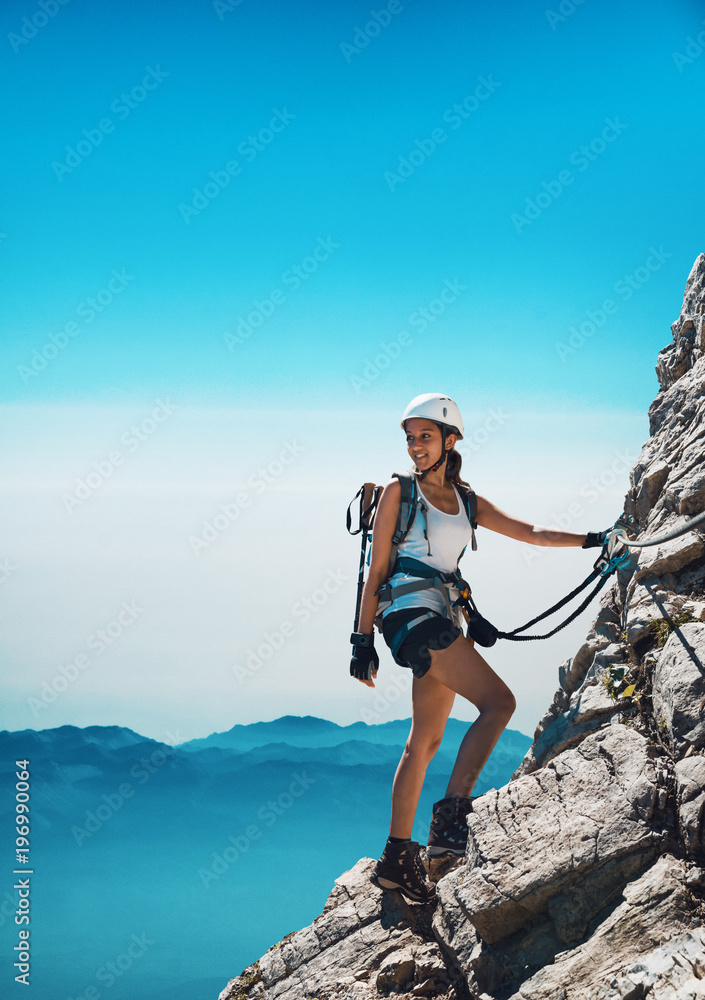 Fit attractive woman mountaineer