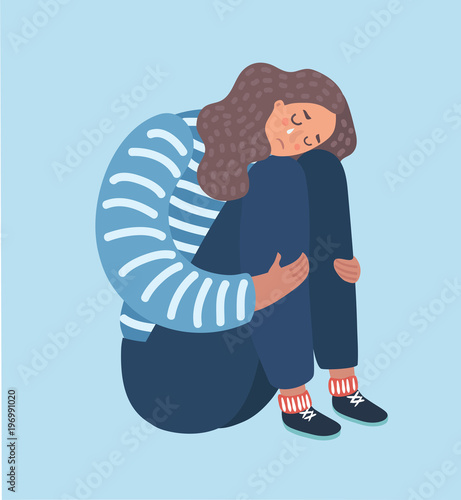 Sad girl sitting and unhappily hugging her knees. 