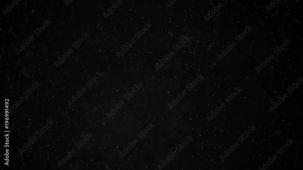 Natural organic dust particles on black background. Glittering Particles With Bokeh. Slow motion. Natural organic dust particles on black background. Glittering Particles With Bokeh. Slow motion.