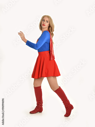 Canvas Print full length portrait of pretty girl wearing super hero costume, standing pose, isolated on white studio background