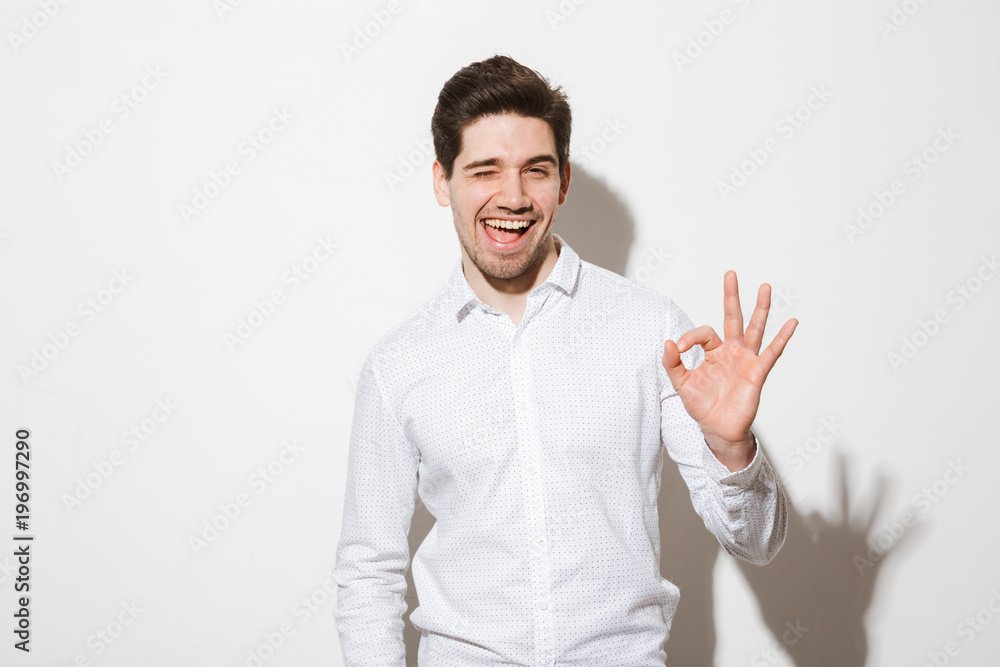 Portrait of a happy young man dressed in shirt Portrait of a happy young man dressed in shirt