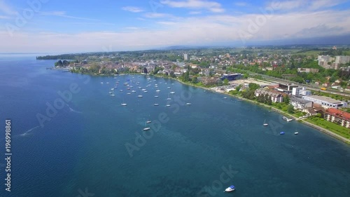 Lake Geneva, Lausanne area. Cinematic drone shot by the lake photo