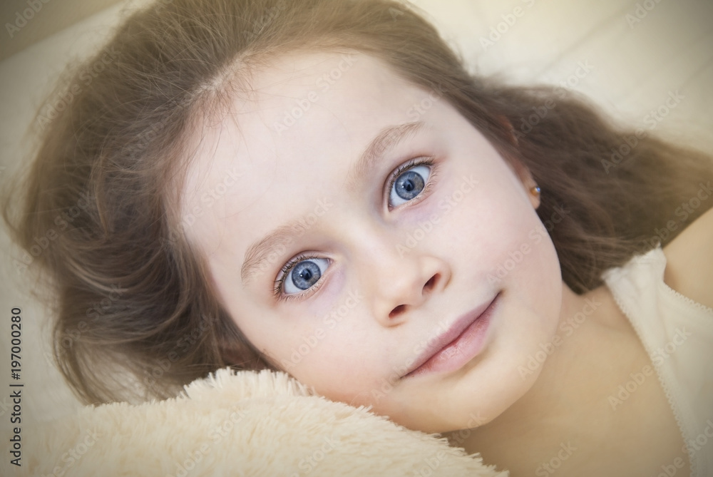 Portret of Adorable Little Girl with Blue Eyes,Waked up in her bed Portret of Adorable Little Girl with Blue Eyes,Waked up in her bed