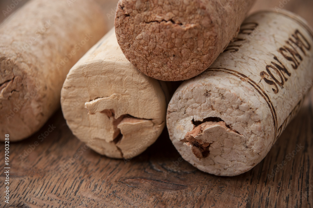 closeup of corks wine on wooden background