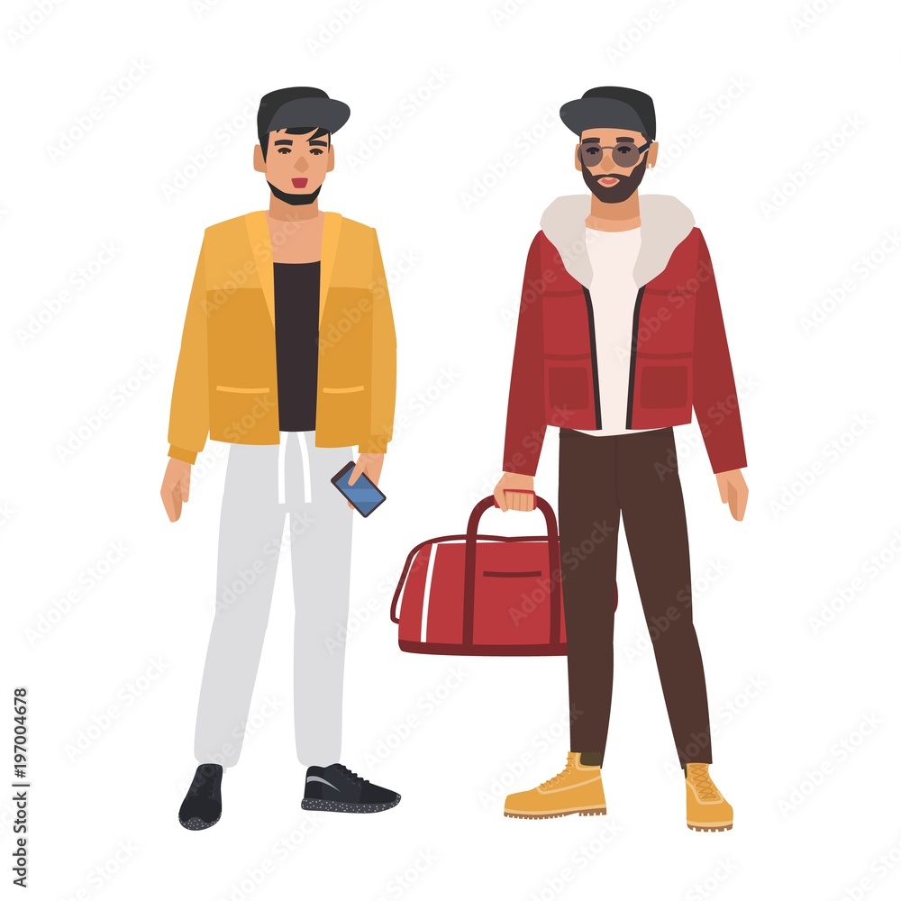 Plakat Pair of caucasian men wearing casual clothing and caps, holding phone and bag, talking to each other