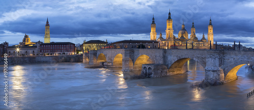 Zaragoza - The cityscape from cathedral Basilica del Pilar tower with the Puente de Piedra bridge,