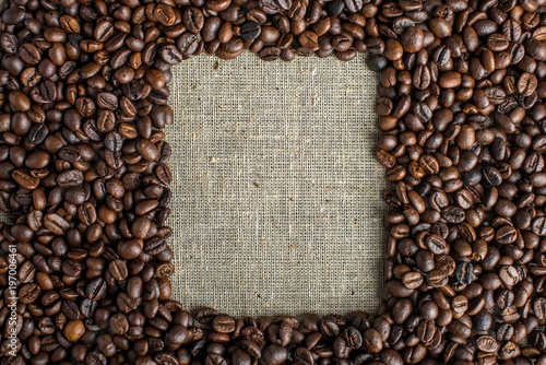 Textured background of coffee beans in the shape of a square frame top view. Concept love for a fresh and fragrant drink