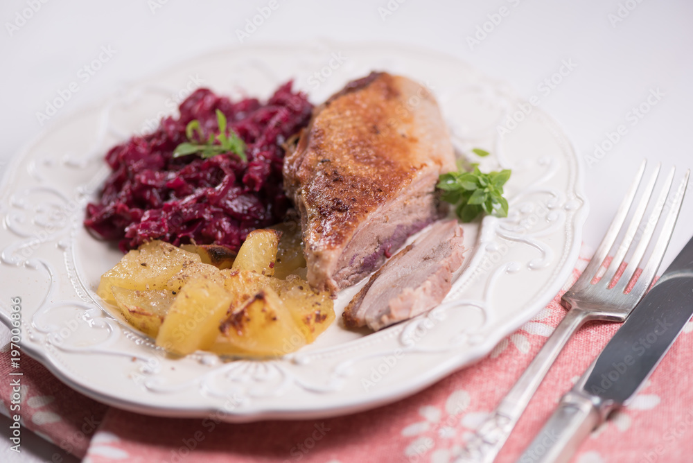 Duck meat with potatoes and braised blue cabbage with raspberries. Duck meat with potatoes and braised blue cabbage with raspberries.
