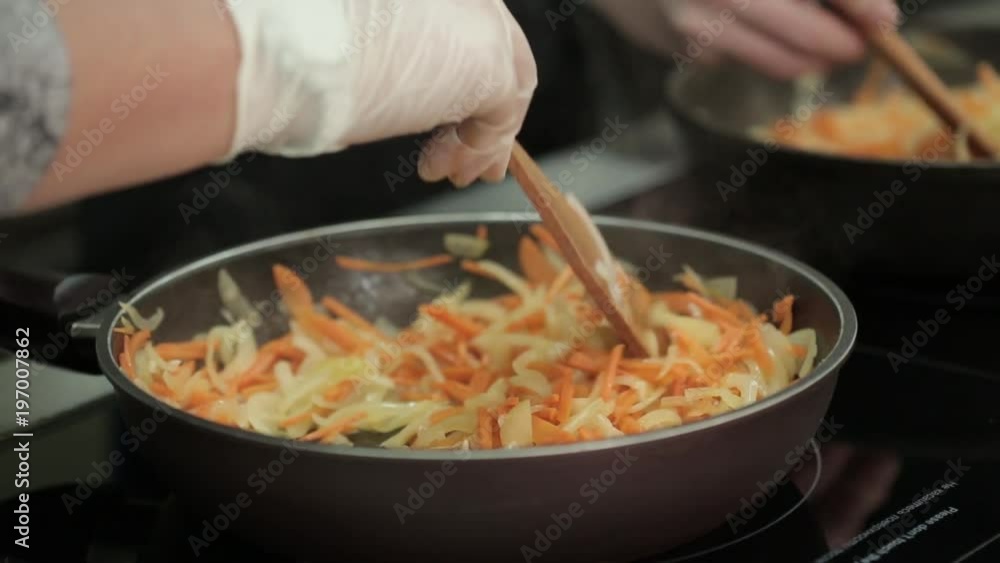 Roasting vegetables by a professional cook. restaurant inside Roasting vegetables by a professional cook. restaurant inside