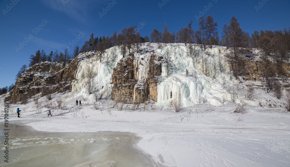 Cliff with frozen waterfalls in South Yakutia,Russia