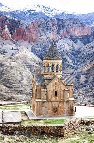 Medieval armenian Noravank monastery complex against red mountains, Armenia
