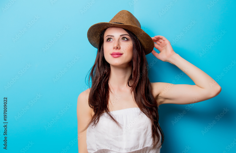 Young girl with long hair on blue background. Young girl with long hair on blue background.