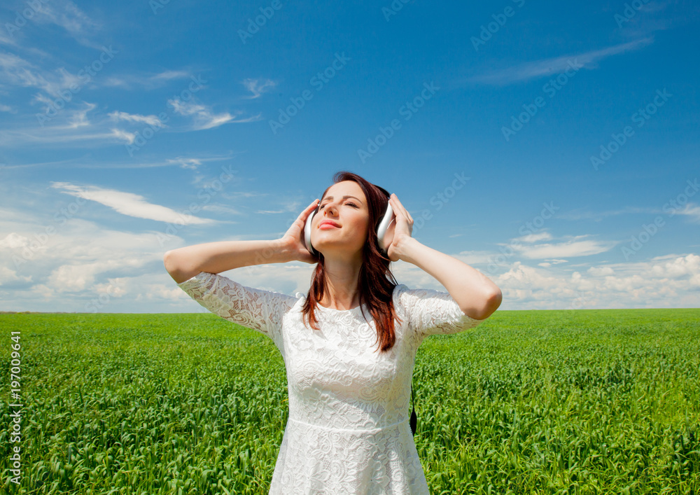 girl with headphones at wheat field girl with headphones at wheat field