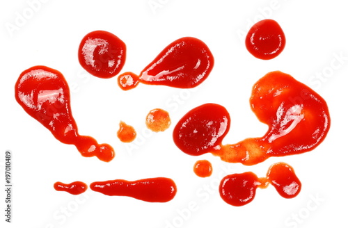 Red ketchup, spread, splashes isolated on white background, tomato pure texture, top view