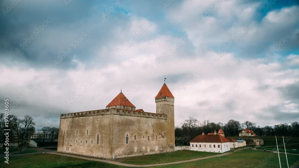 Kuressaare, Saaremaa, Estonia. Time-lapse Time Lapse Timelapse Episcopal Castle In Sunset. Traditional Medieval Architecture, Famous Attraction Landmark. Clouds Fast Moving In Sunny Sky. Kuressaare, Saaremaa, Estonia. Time-lapse Time Lapse Timelapse Episcopal Castle In Sunset. Traditional Medieval Architecture, Famous Attraction Landmark. Clouds Fast Moving In Sunny Sky.