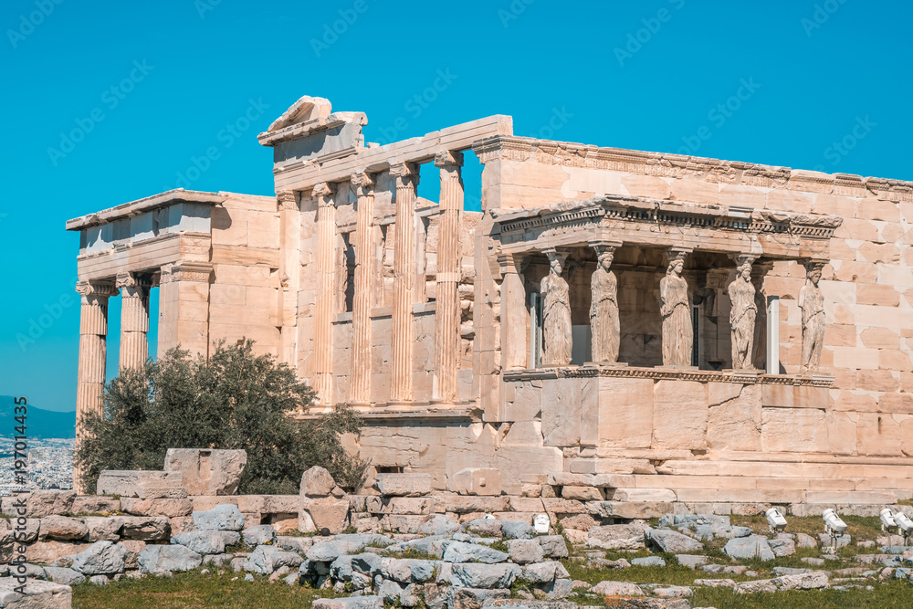 Erechtheion and Temple of Athene at the Acropolis hill in Greece. Caryatids at Erechtheum of Parthenon