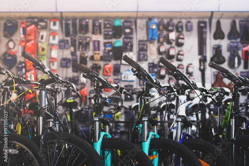various modern bikes selling in bicycle shop photo