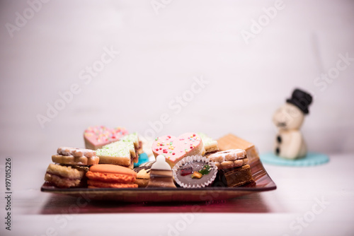 Traditional celebration festive homemade decorated sweets on wooden background