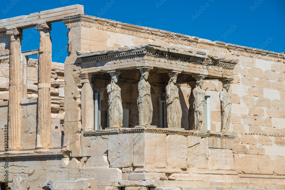 Erechtheion and Temple of Athene at the Acropolis hill in Greece. Caryatids at Erechtheum of Parthenon