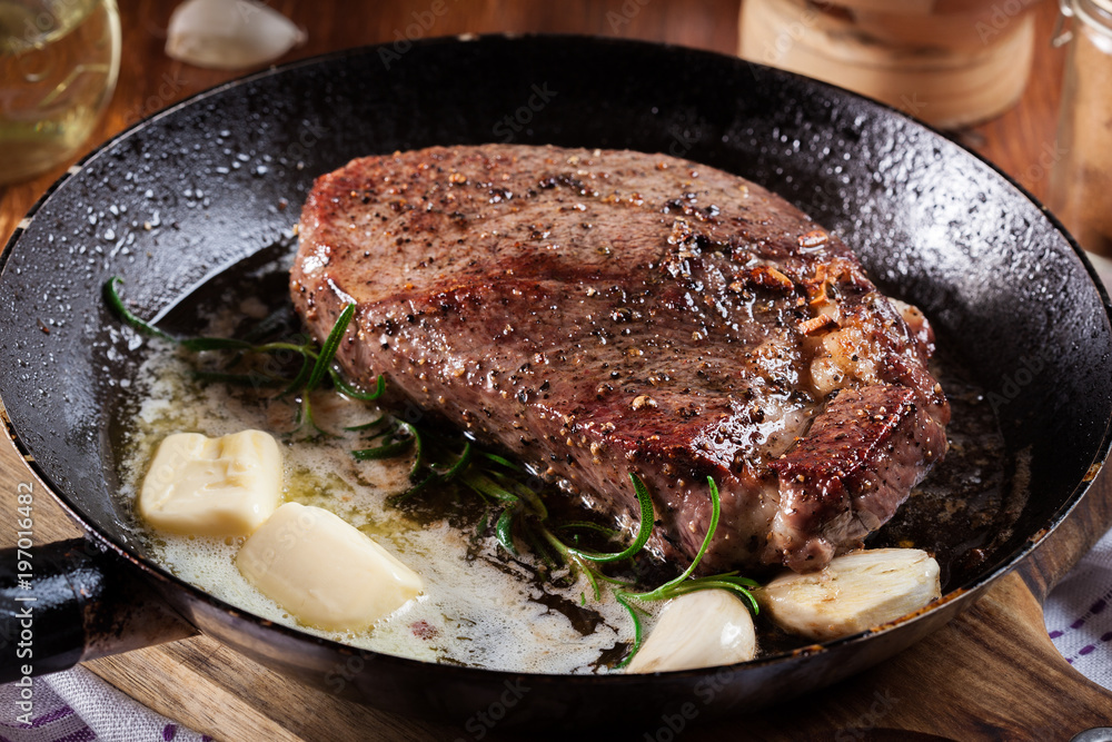Preparing beef steak with cubed butter Preparing beef steak with cubed butter