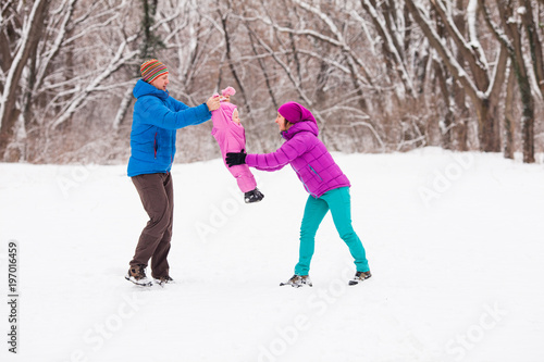Family in the winter forest