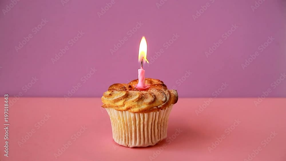 Cupcake with one lighted candle for the birthday. Time lapse video Cupcake with one lighted candle for the birthday. Time lapse video