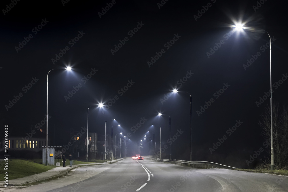 night street with modern street lights, central view