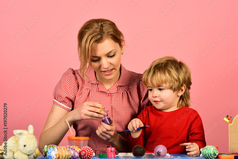 Naklejka premium Easter and happy moments concept. Woman and little boy