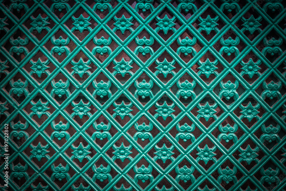 Fragment of decorative painted metal door in turquoise intens co Fragment of decorative painted metal door in turquoise intens co