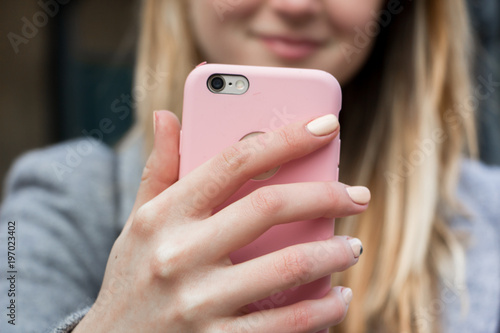 Blonde with pink phone
