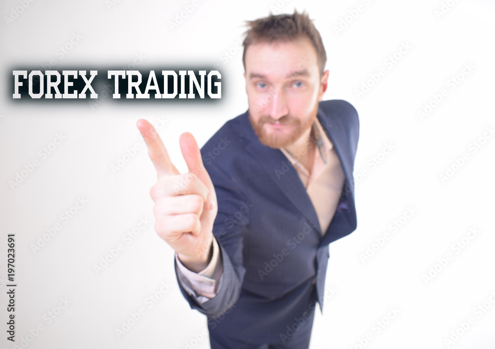 A businessman shows an inscription:FOREX TRADING A businessman shows an inscription:FOREX TRADING