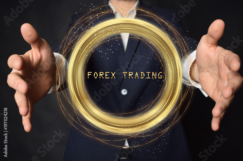 A businessman shows an inscription:FOREX TRADING